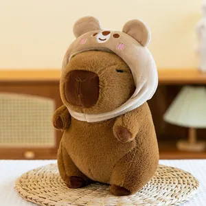 Soft capybara plush toy with a cute bear hood detail, perfect for cozy room decor.