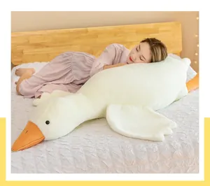 Premium soft giant white goose plush toy long pillow shown with a person on a bed