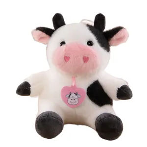 Cute black and white cow plush toy stuffed animal with pink heart nose and heart tag