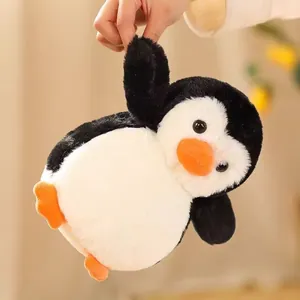 Peluche de pingüino suave con un cuerpo redondo lindo y una textura esponjosa única.