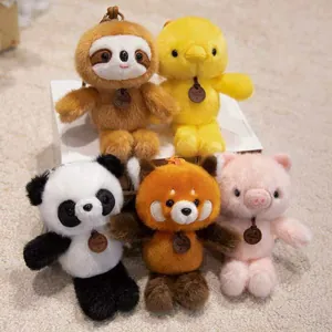 Group view of five cute plush animal keychain pendants: panda, chick, sloth, red panda, pig