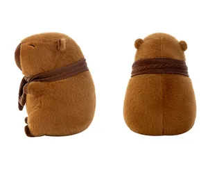 Detailed side and back view of a soft brown capybara plush toy wearing a knitted scarf