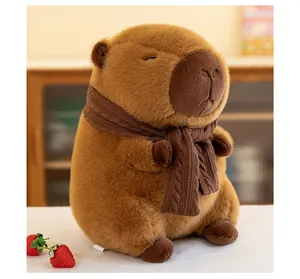 Detailed macro view of a cute brown capybara plush toy wearing a cozy knitted scarf