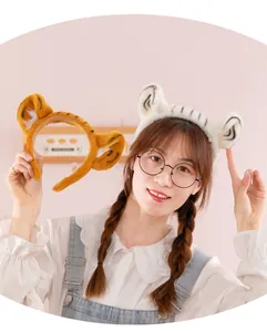 Close-up of a model wearing a plush tiger ear headband for performance and cosplay