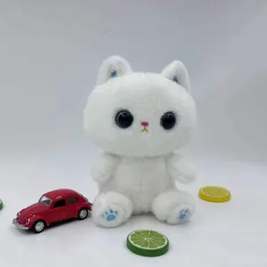 Front view of a cute white plush cat toy with big black eyes and blue paw details