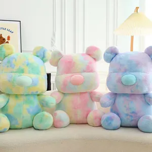 Three colorful tie-dye plush teddy bear toys with vibrant pastel rainbow color patterns