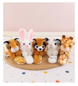 Detailed view of various plush animal tail and paw toys on a straw mat.