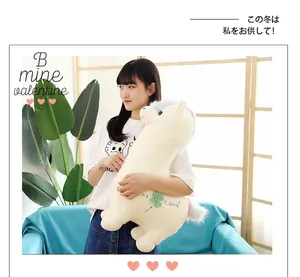 Large cute white alpaca plush toy with rainbow hair held by a model for gift idea
