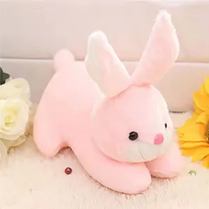 Close-up detail of a soft pink prone bunny plush toy with fuzzy texture and long ears