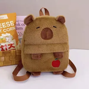 Adorable brown capybara plush backpack with a small red apple embroidery detail