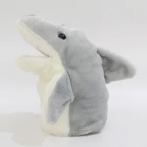 Side view of plush shark hand puppet with soft gray and white fur and movable mouth