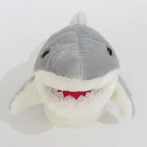 Detailed view of a soft grey shark hand puppet plush toy with an open mouth design.