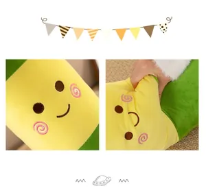 Detailed view of cute embroidered face and soft squeezable texture on plush cigarette pillow