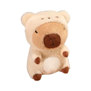 Detailed view of cute capybara plush toy wearing a soft cream bear costume hoodie