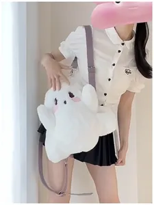 Detailed view of a cute white plush ghost backpack worn by a model in a casual outfit