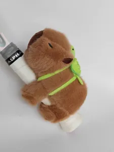 Close-up detail of Capybara plush slap bracelet featuring a cute green turtle backpack.