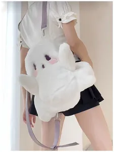 Detail view of a cute white ghost plush backpack worn by a model in a kawaii style.