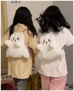 Detailed back view of two cute white plush ghost backpacks being worn indoors by girls