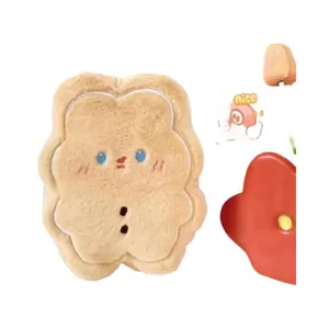 Close-up view of a cute bear cookie plush toy with soft brown gingerbread man texture
