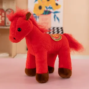 Vibrant red plush horse toy featuring a traditional Chinese blessing saddle design