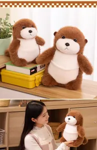 Adorable soft brown sea otter plush toy shown in a cozy home setting with a model