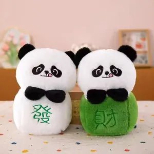 Detail view of two adorable panda plush pendants with lucky Chinese characters.