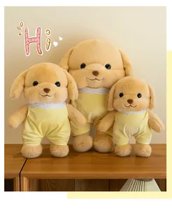 Close-up of three cute dog plush dolls in yellow lace outfits on a wooden shelf