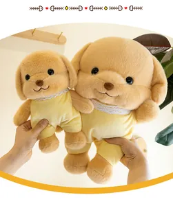 Close-up of two cute dog plush toys in yellow outfits being held in a cozy home setting