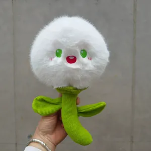 Close-up of cute white dandelion plush toy with green stem and embroidered face