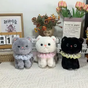 Set of three cute plush kitten toys in grey white and black with lace collars