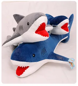 Detail shot of blue and grey starry shark plush toys made of soft fabric