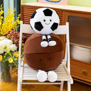Adorable plush football and basketball character dolls stacked on a white chair as decor