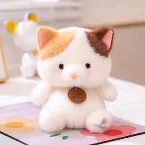 Cute white calico kitten plush toy with soft fur and Yirong Fang wooden tag detail