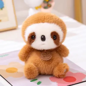 Adorable fluffy brown sloth plush toy sitting on desk for home decoration and comfort