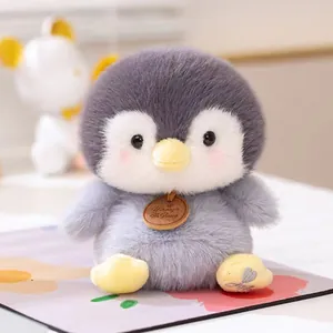 Adorable grey penguin plush toy desk companion with soft faux fur and brand tag