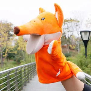 Detailed view of an orange plush fox hand puppet with a movable mouth for children's storytelling