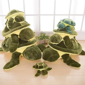 Stacked collection of cute green and yellow sea turtle plush toys in various sizes