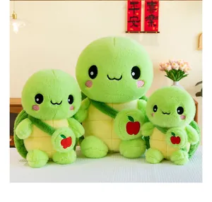 Set of three cute green plush turtle toys with apple backpacks shown in various sizes