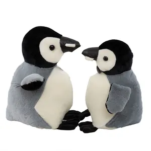 Pair of realistic penguin plush toys for polar animal lovers and children's room decor