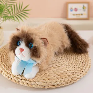 Close-up of lifelike Ragdoll cat plush toy with blue eyes and a silk bow tie