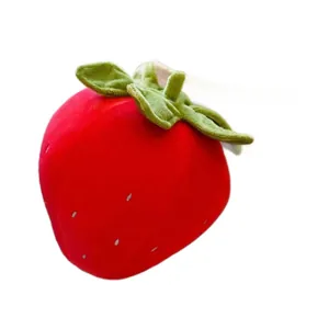 Adorable soft red strawberry plush fruit pillow toy with green leaves on white background