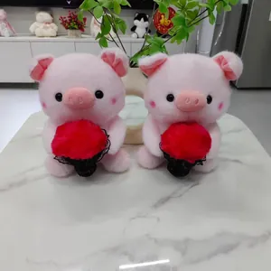 Pair of cute pink plush pigs holding red fuzzy bouquets on marble table