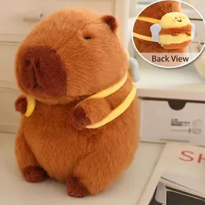 Close-up detail of the adorable bee accessory on the soft brown capybara plush toy