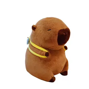 Detailed view of a cute brown capybara plush toy wearing a yellow bee backpack.
