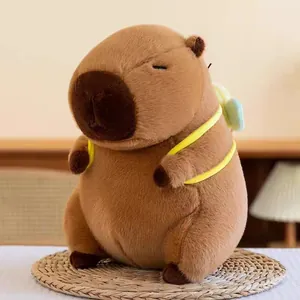 Detailed view of a soft brown capybara plush toy with cute yellow bee wings decoration