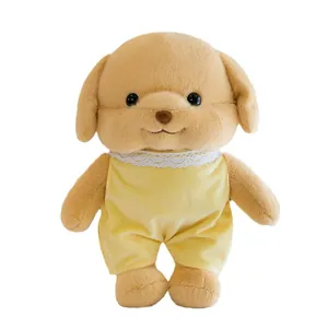 Adorable golden poodle plush toy dog wearing a yellow romper outfit with white lace collar