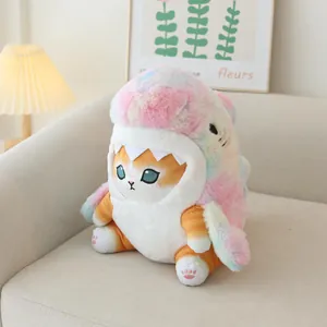 Plush shark cat doll in colorful rainbow costume sitting on a cozy beige sofa