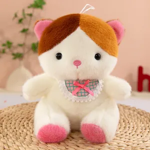 Soft kitten plush toy with pink bib and bow detail