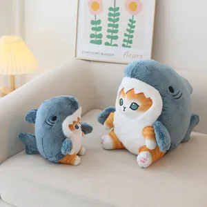 Cute shark cat plush toys sitting on a cozy sofa as creative home decor or birthday gifts.