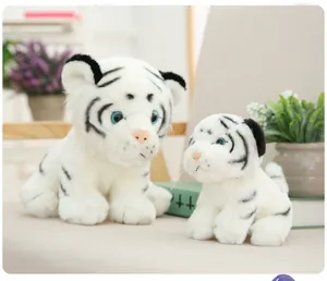 Detailed view of white tiger plush toy mother and cub set in a cozy home setting